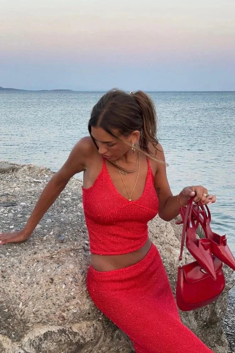 Red sparkly top and pants set by Taylynn, shimmering sequins detailing on a cozy knit fabric.