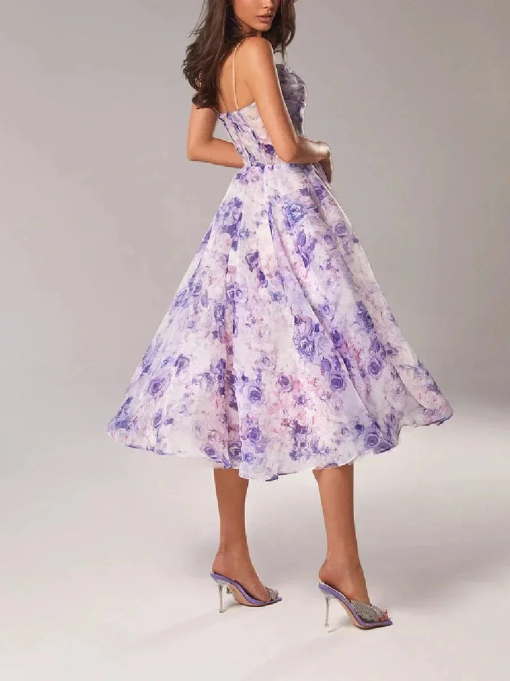 Strapless midi dress in floral print with a flattering silhouette and lightweight fabric perfect for summer events and…