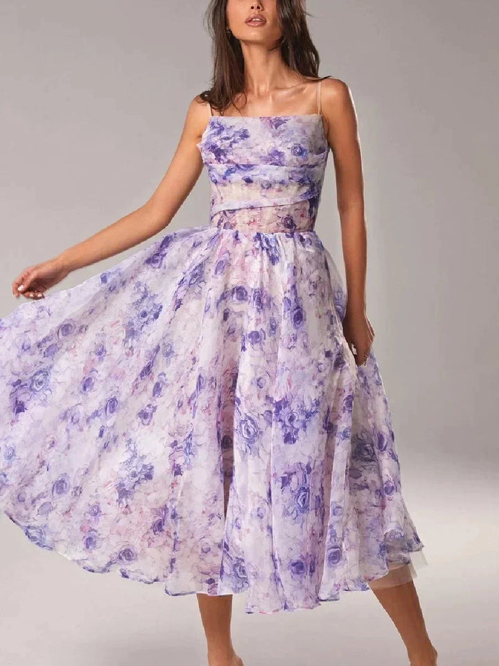 Violet strapless midi dress with floral print, perfect for a sunny day outing. Made of lightweight fabric with a flattering…