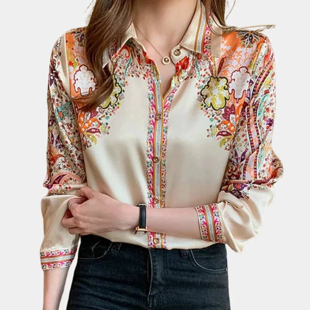 Multicolor floral blouse featuring a versatile design with intricate floral patterns and soft, comfortable material.
