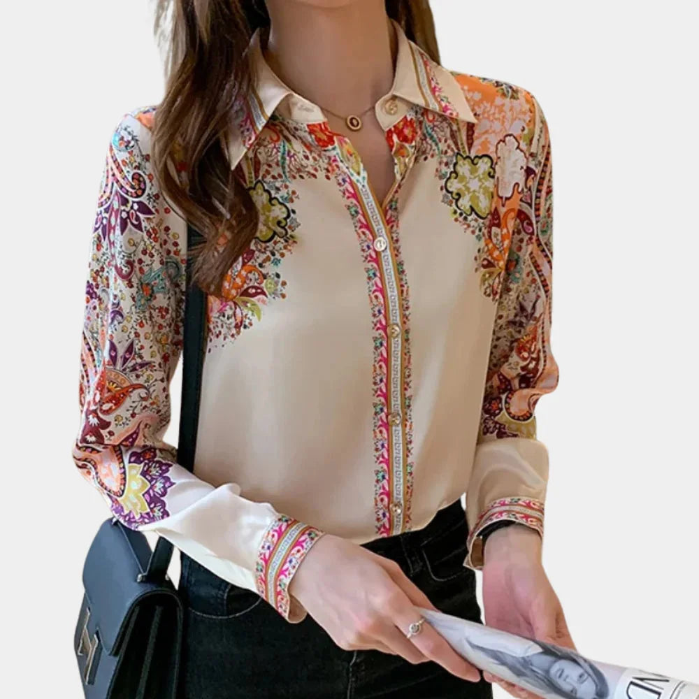 Multicolor floral blouse made from lightweight cotton blend, perfect for effortless styling in various occasions.
