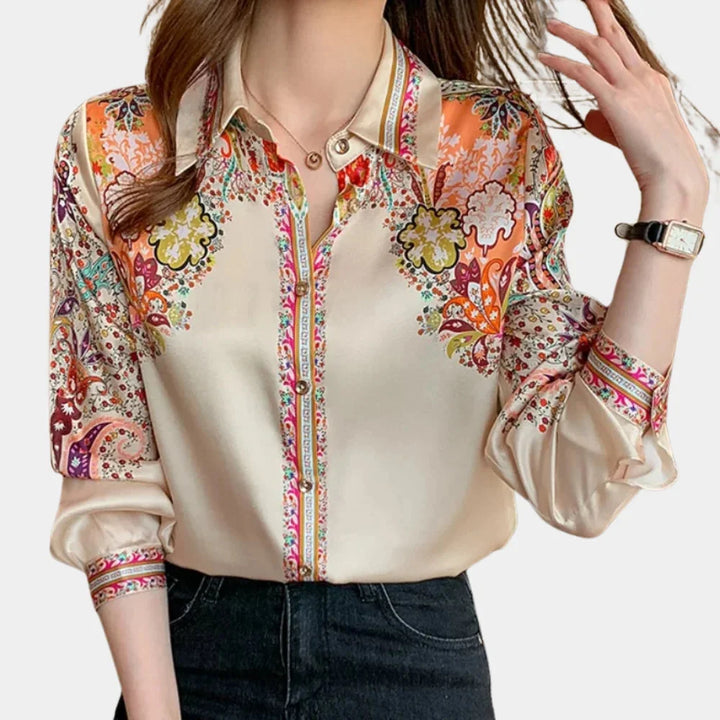 Beige floral blouse with vibrant multicolor design, perfect for versatile styling.