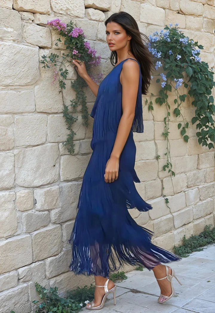Navy one-shoulder maxi dress with fringes, featuring a bohemian design. Ideal for a casual yet stylish look.