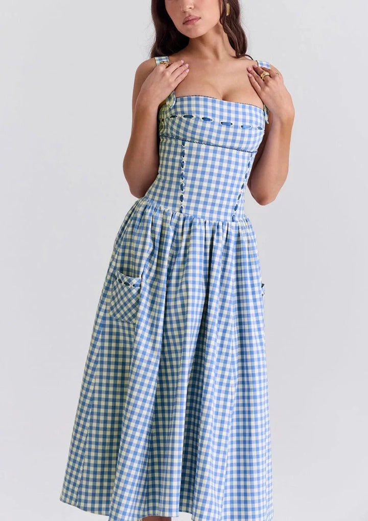 Off-shoulder midi dress in summery blue color with a breezy design, perfect for warm weather.