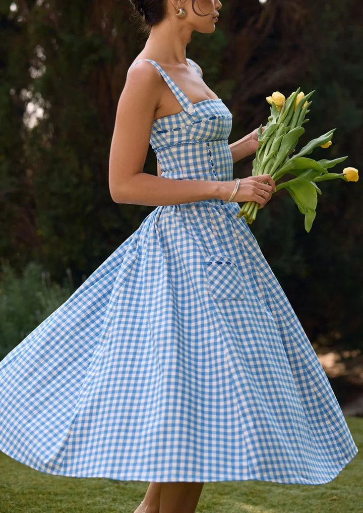 "Tierney off-shoulder midi dress in summery blue, perfect for warm weather. Features a relaxed silhouette and a stylish…