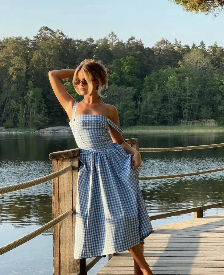 Women's summery blue off-shoulder midi dress in Colour, featuring a relaxed fit, fluttery sleeves, and versatile off-shoulder…