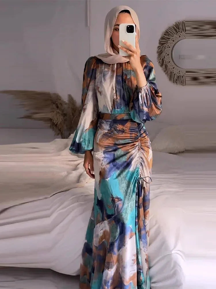 "Multicolored pleated maxi dress with sleeves made of lightweight breathable fabric in a striking design."