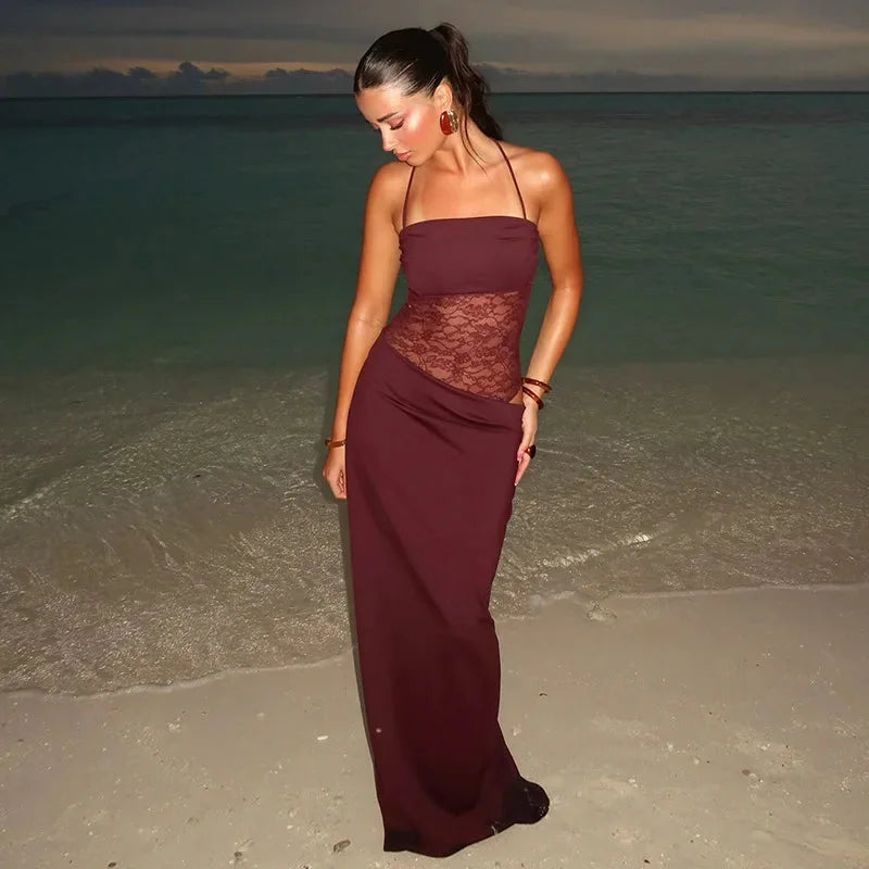 "Sleeveless evening maxi dress in black lace fabric, featuring a flattering silhouette and intricate lace detailing."