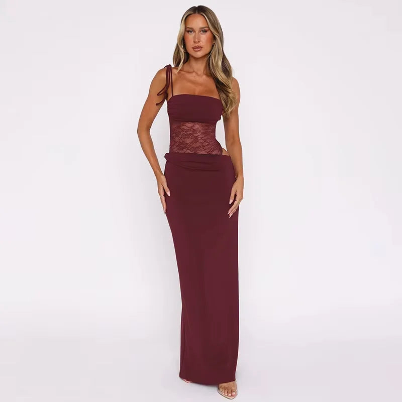 Sleeveless evening maxi dress in black with intricate lace detailing on the bodice and hem, perfect for formal events and…