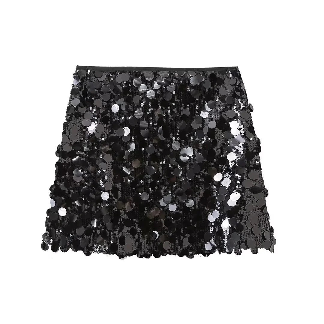 "Black sequin mini skirt with sleek fit, perfect for a night out. Shimmery and eye-catching design."
