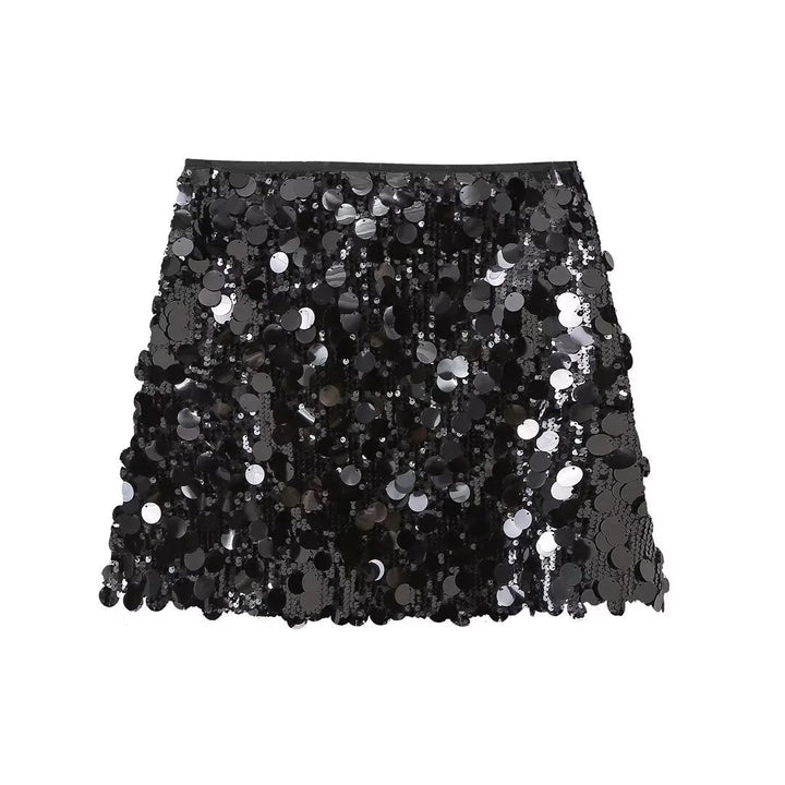 "Black sequin mini skirt with sleek fit, perfect for a night out. Shimmery and eye-catching design."