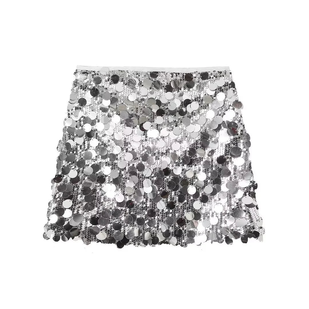 "Silver sequin mini skirt with sleek fit, perfect for adding sparkle to any outfit."