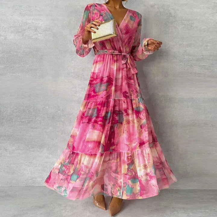 Pink long sleeve maxi dress with floral print on a woman model, made of soft and comfortable fabric, perfect for casual or…