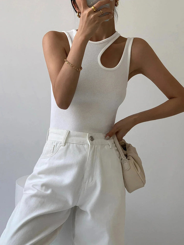 "Black sleeveless top featuring asymmetric ribbed knit design for a modern and edgy look."