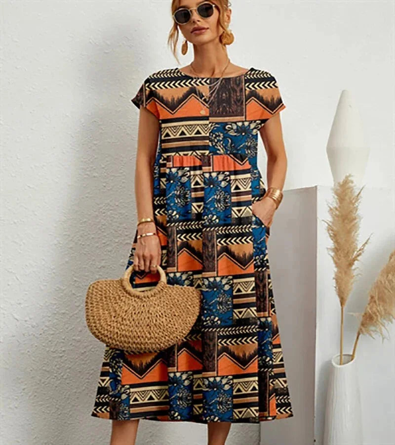 Orange cotton midi dress with charming floral print perfect for everyday wear.