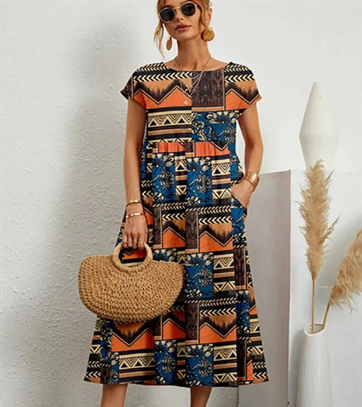 Orange cotton midi dress with charming floral print perfect for everyday wear.