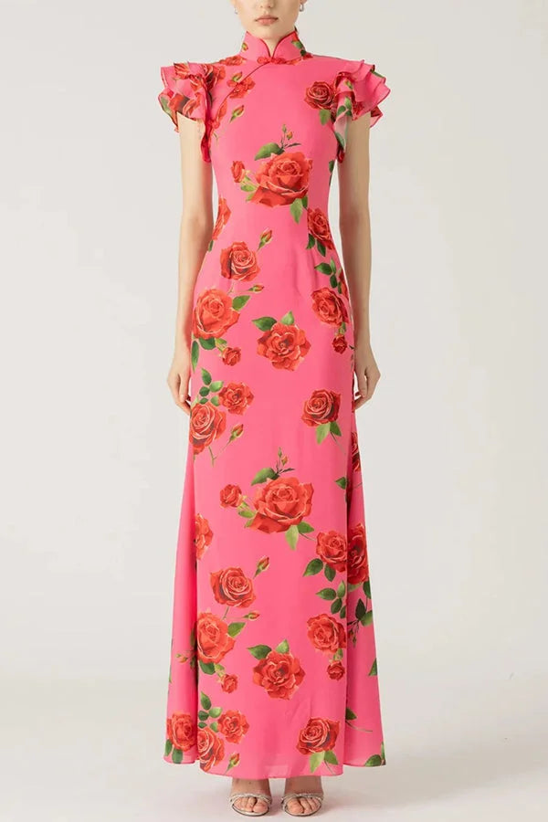 Pink floral maxi dress with high neckline and ruffled sleeves, made from soft cotton blend fabric.