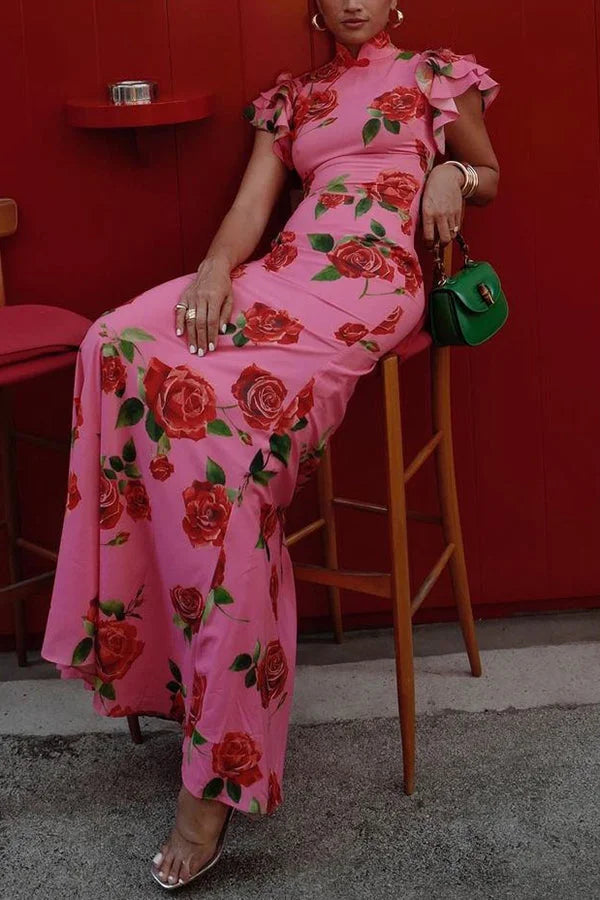 Pink floral maxi dress with high neckline and ruffled sleeves in soft cotton blend for a stylish and comfortable look.