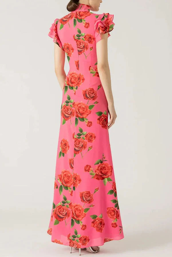 Pink floral maxi dress with high neckline and ruffled sleeves, perfect for a romantic summer day.