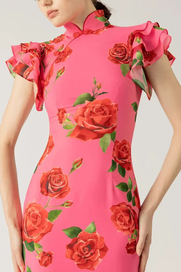 Pink floral maxi dress with high neckline and ruffled sleeves, perfect for a feminine and elegant look.
