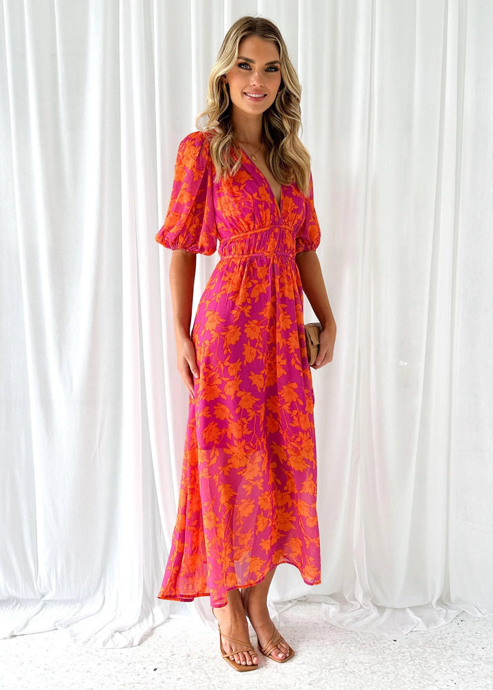 Bright pink floral maxi dress with a whimsical willow pattern, perfect for summer events. Made from lightweight, breathable…