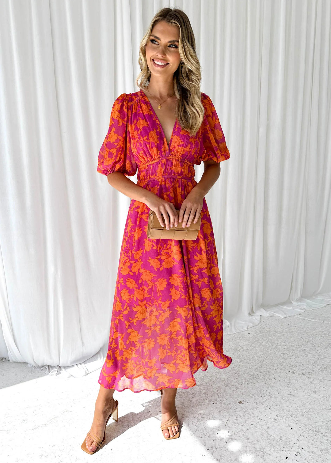 "Bright pink floral maxi dress featuring a whimsical willow print, perfect for a summery and feminine look."