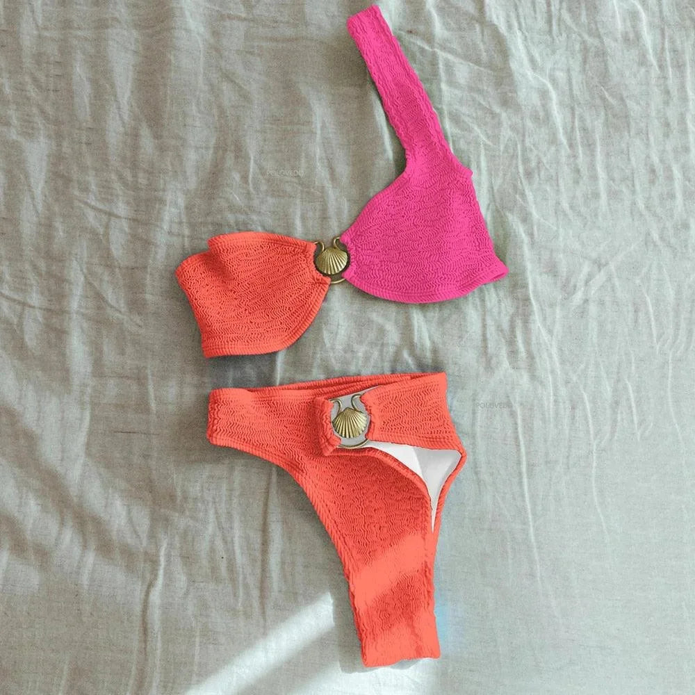 Women's asymmetrical bikini with textured finish in a soft and comfortable fabric, perfect for a chic and modern beach look.