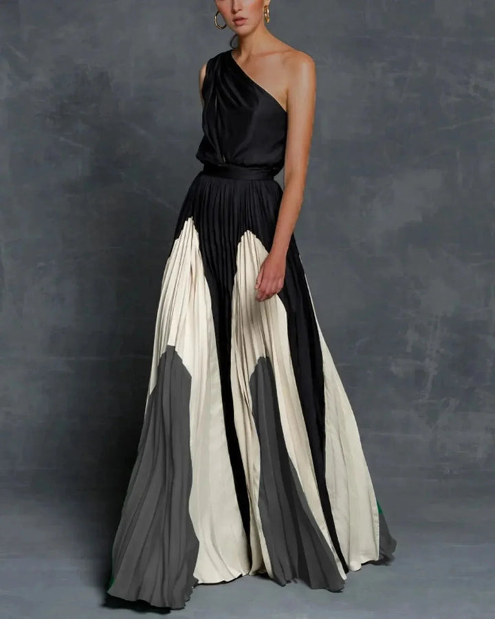 Grey one-shoulder pleated maxi dress, a chic and elegant option for any occasion, showcasing a unique and sophisticated…