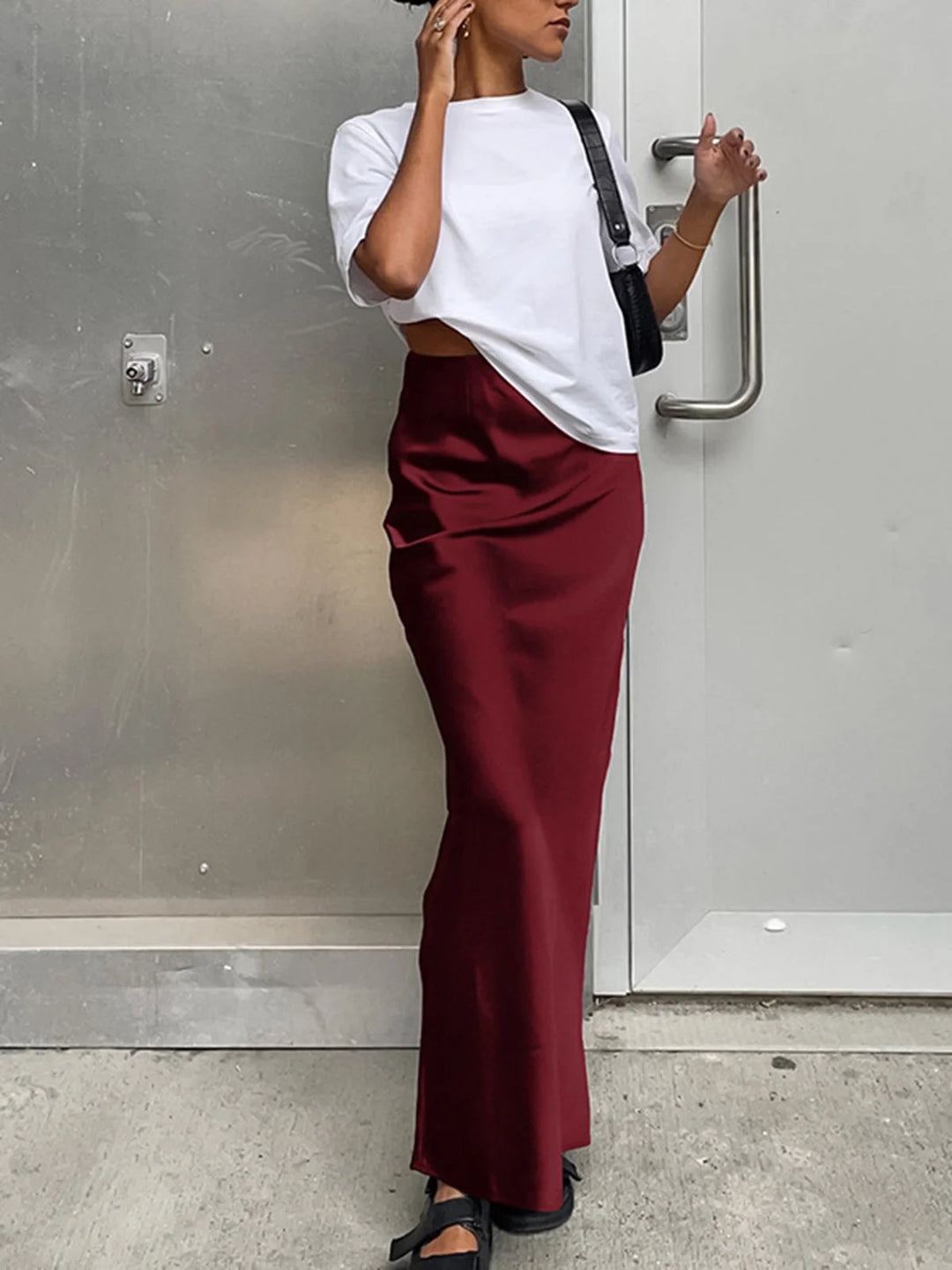 Flowy satin maxi skirt in rich Burgundy color, perfect for elegant occasions. Made of satin fabric, featuring a flattering…
