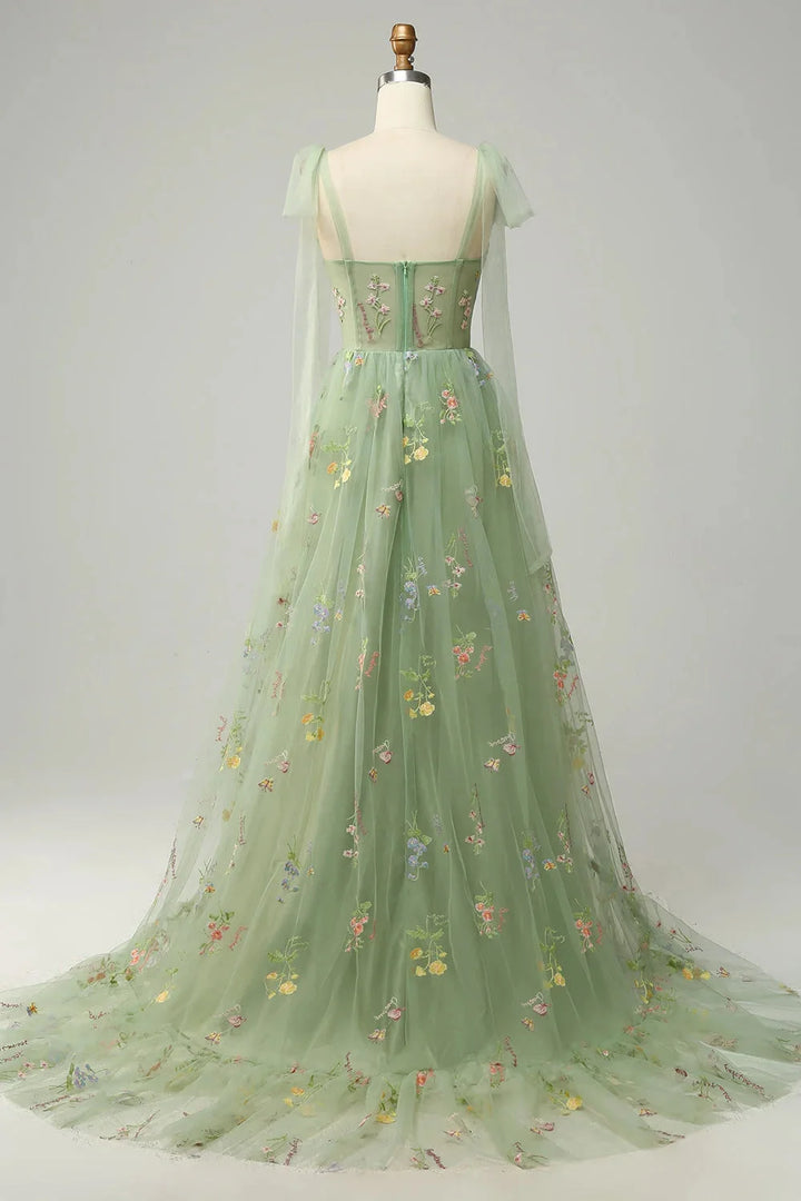 "Yanely embroidered tulle dress featuring sheer overlay, delicate floral embroidery, and elegant design"