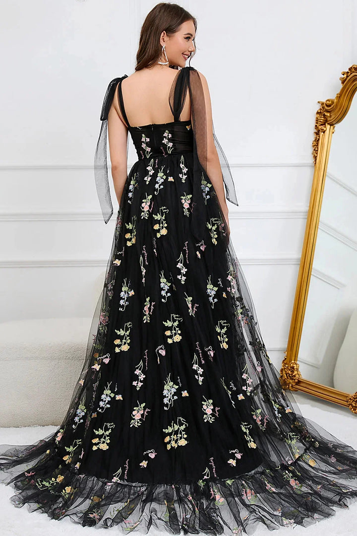 White Yanely dress with intricate embroidery on tulle fabric, featuring a sheer overlay for a romantic and elegant look.