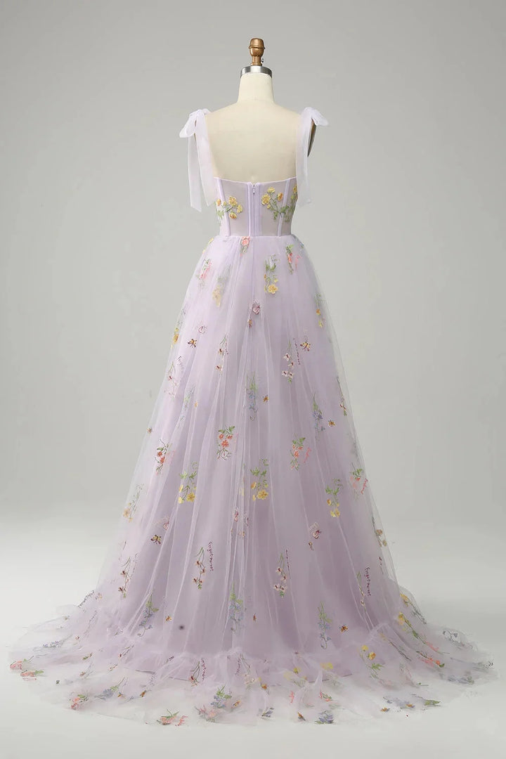 "Yanely tulle dress with sheer overlay, featuring elegant embroidery detail on a lightweight and flowy fabric."