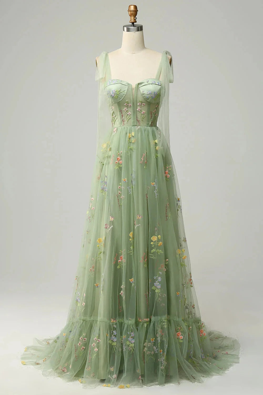 Green Yanely tulle dress with embroidered details, sheer overlay, and a flattering silhouette perfect for special occasions.