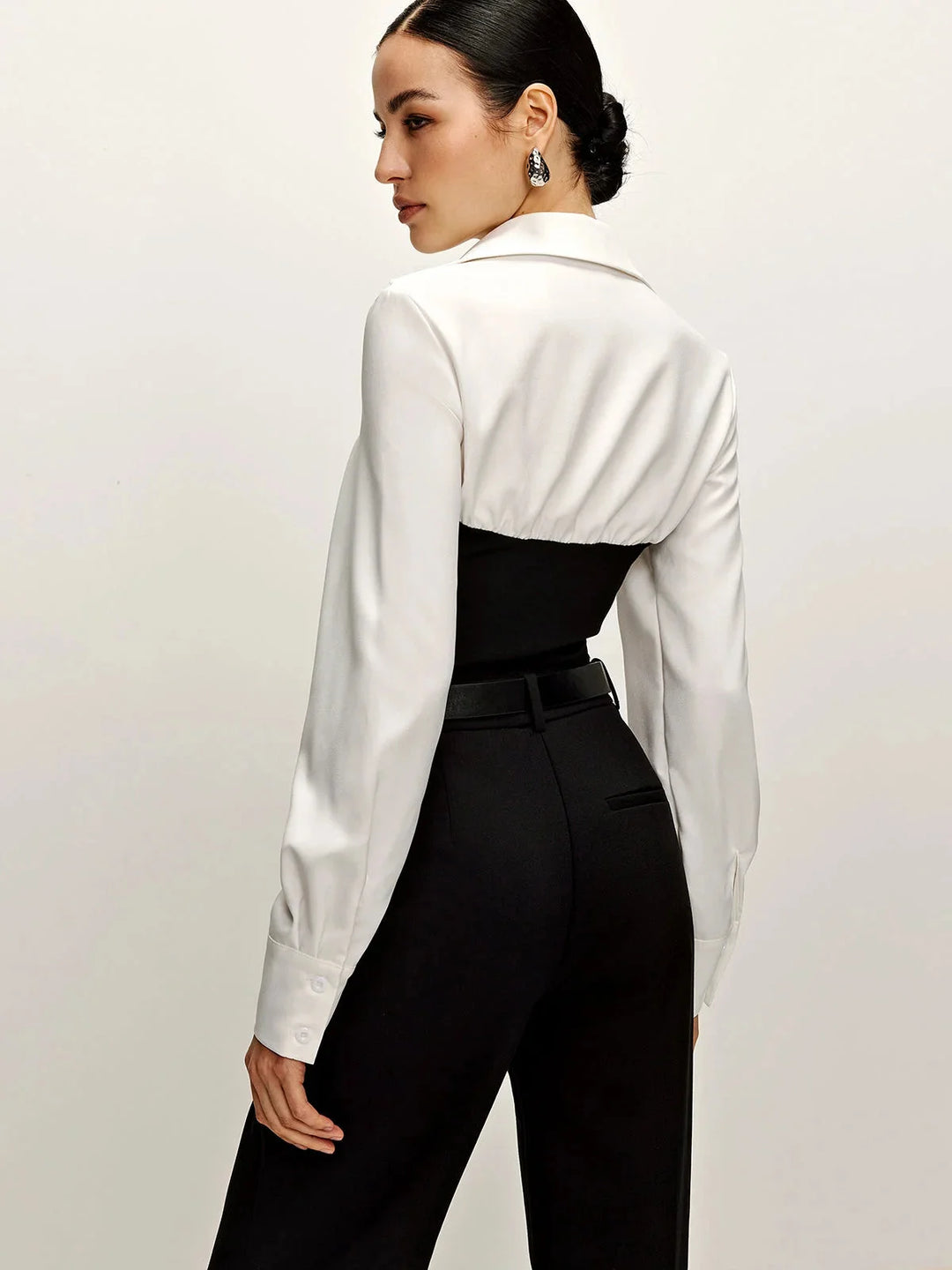 Two-tone tailored blouse with a classic collar in a modern design, perfect for a sophisticated look.