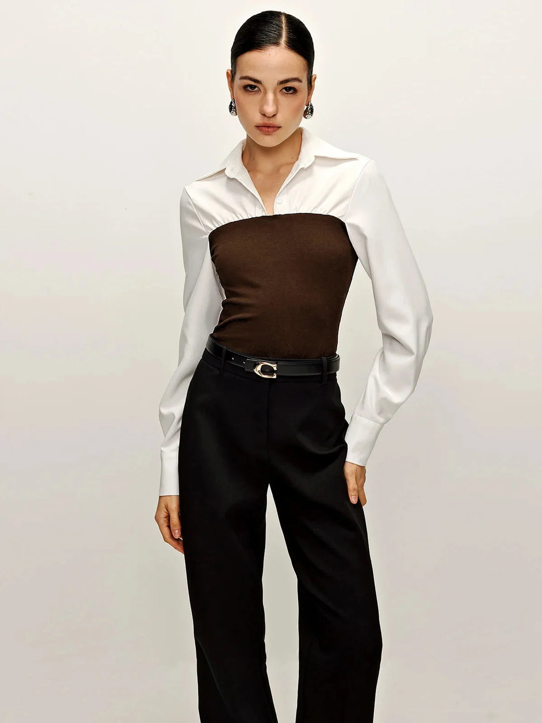 Brown two-tone tailored blouse with collar, crafted from soft cotton blend. Perfect for casual and semi-formal occasions.