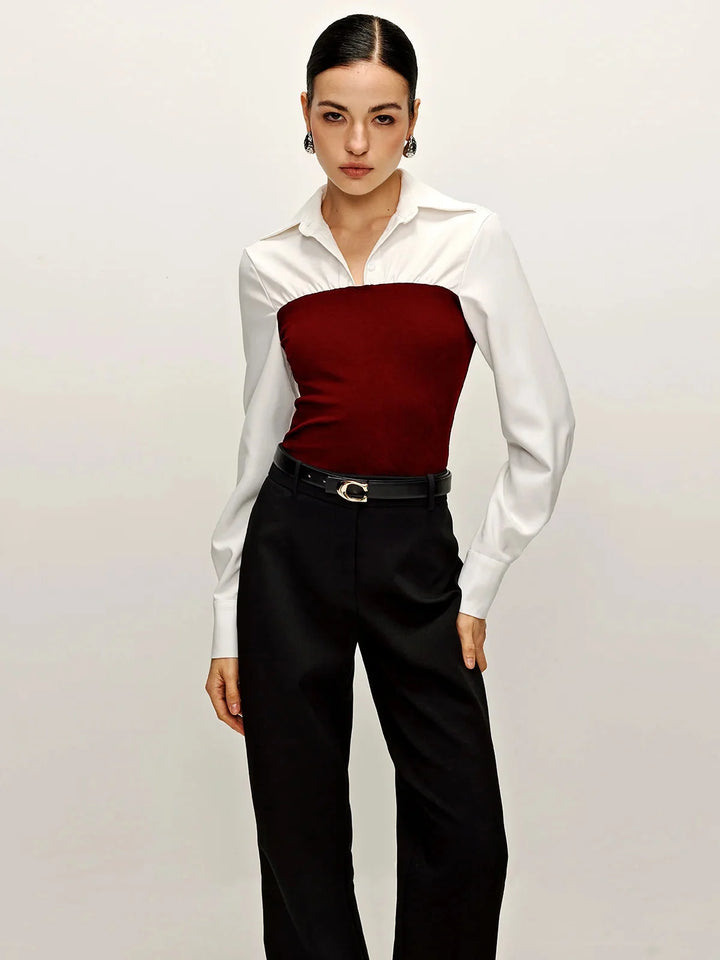 Red two-tone tailored blouse with collared neckline, timeless design in soft fabric perfect for formal occasions.