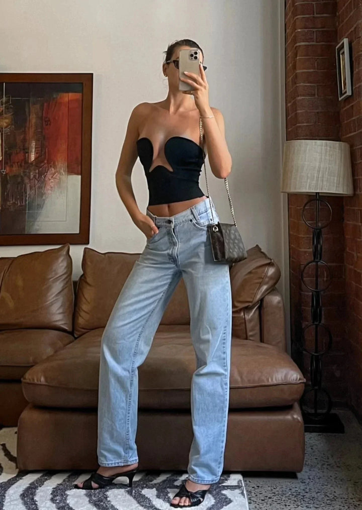 Women's strapless bustier with wavy trim in a snug fit. Features a comfortable and stylish design.