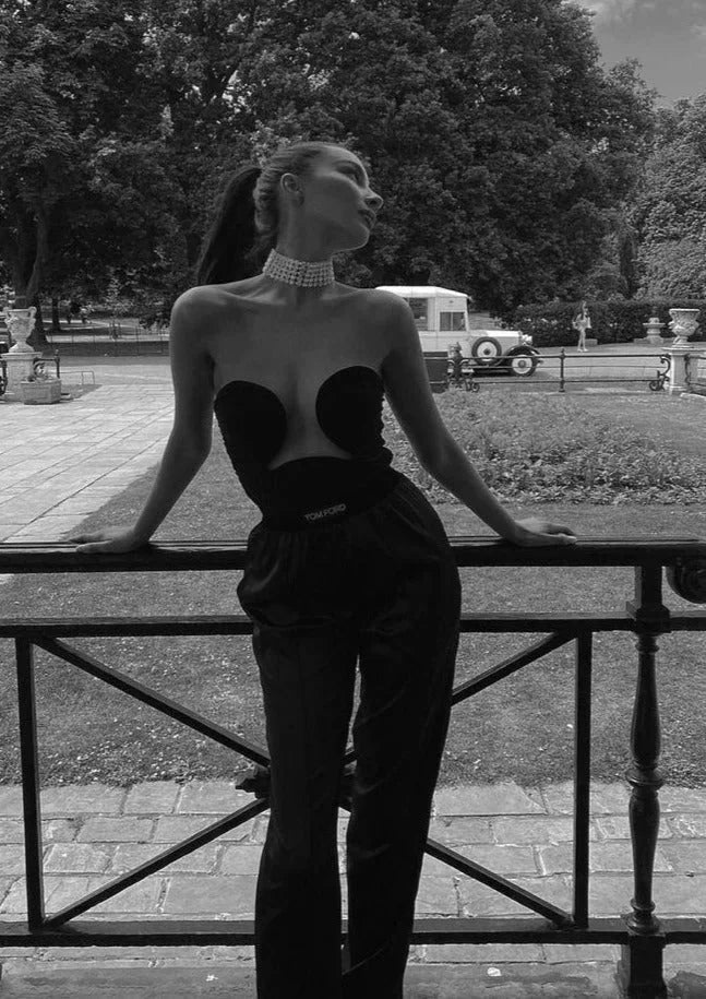 "Black strapless bustier with wavy trim for women, made of soft and stretchy fabric, perfect for a stylish and comfy look."