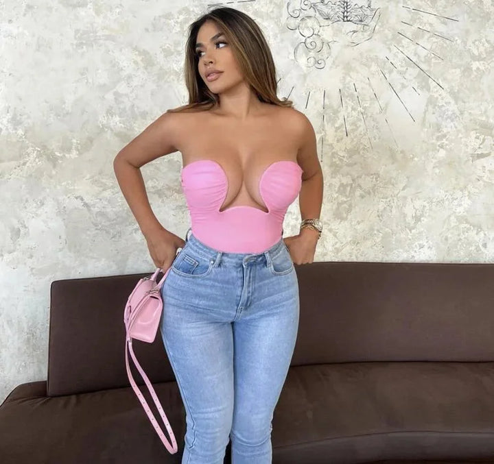 "Baby pink strapless bustier with wavy trim for women, made from snug and comfortable material."