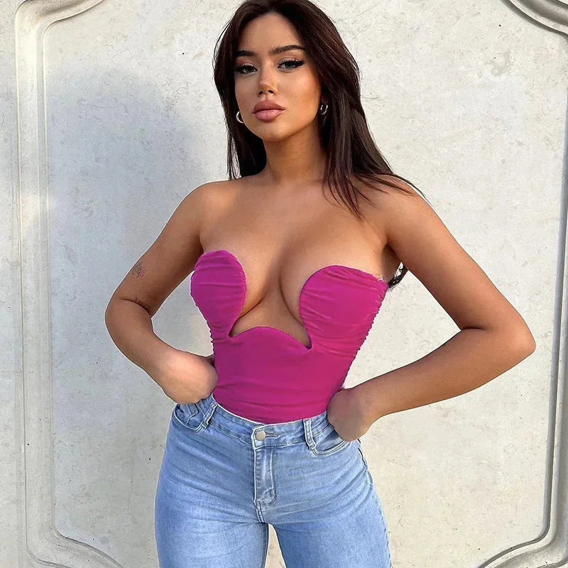 Fuchsia strapless bustier for women with wavy trim detailing, made with soft and snug material for a stylish and comfortable…
