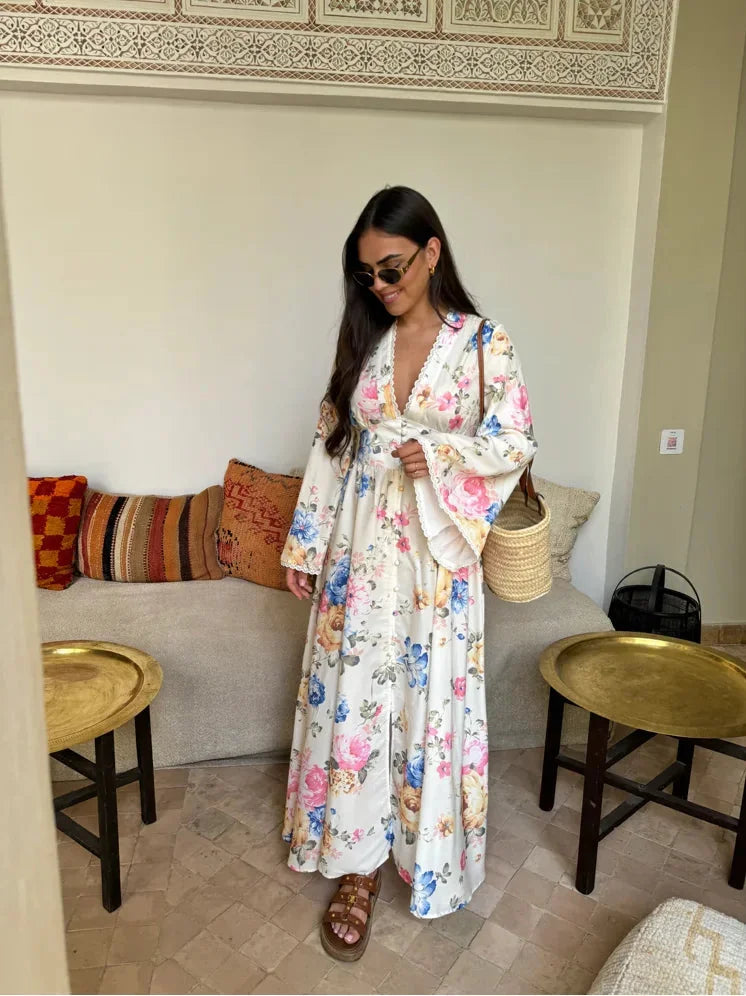 "Yelitza long sleeve boho dress with floral pattern, made from soft, flowy fabric. Perfect for a casual yet elegant look."