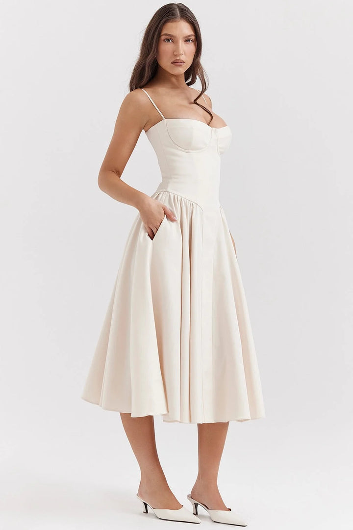 Beige slimming bodice sundress with flared skirt, featuring a breathable fabric and flattering silhouette for a stylish…