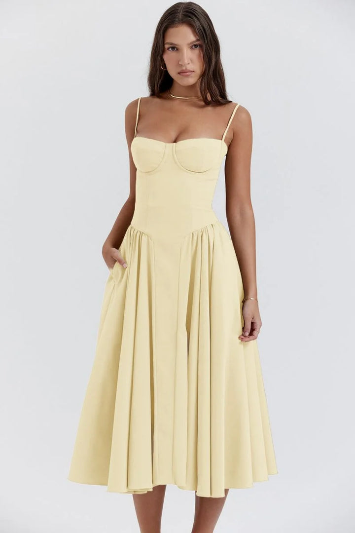 Yellow slimming bodice sundress with flared skirt by Yides. Features button-up front, breathable fabric, and flattering…