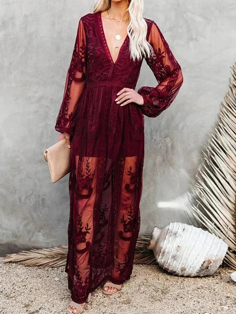 "Black sheer lace maxi dress with long sleeves, perfect for a chic and elegant look"