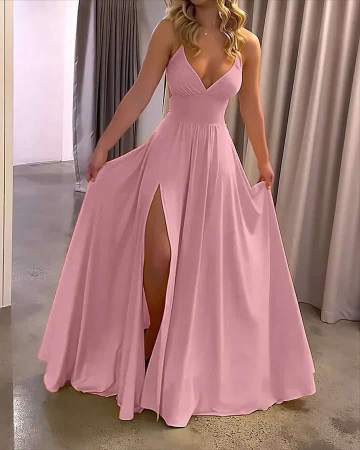 "Flowing pink maxi dress with deep slit, made from soft breathable fabric, perfect for summer days"