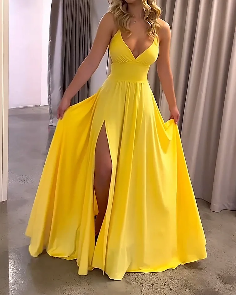 Yellow Zeppelin maxi dress with deep slit, made from flowy fabric for a relaxed and elegant look.