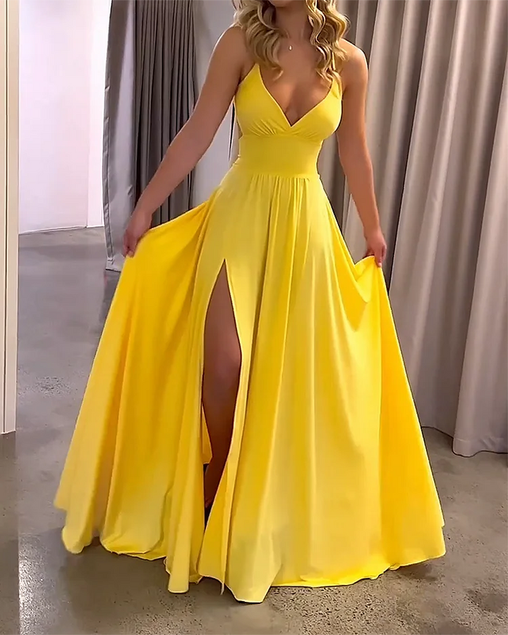 Yellow Zeppelin maxi dress with deep slit, made from flowy fabric for a relaxed and elegant look.