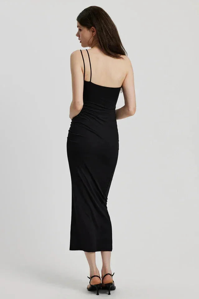 Black midi dress with sculptural floral detail, sleek and modern design, perfect for a special occasion.