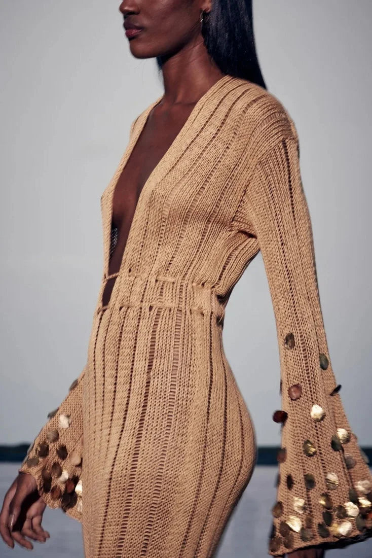 Gold sheer dress with sequin details, perfect for evening events.