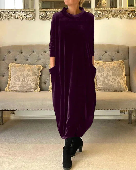 Purple Zoya midi dress crafted in soft velvet with practical side pockets for a comfortable and stylish look.